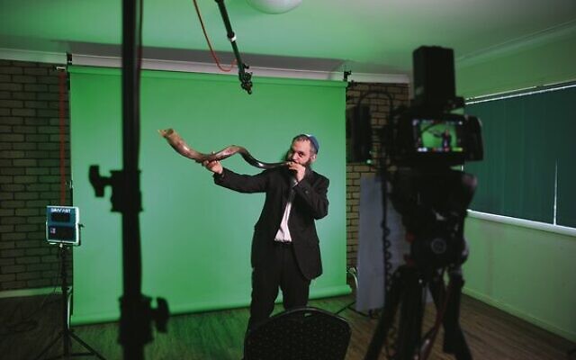 Rabbi Reuvi Cooper blowing the shofar on set. Rabbi Reuvi Cooper blowing the shofar on set.