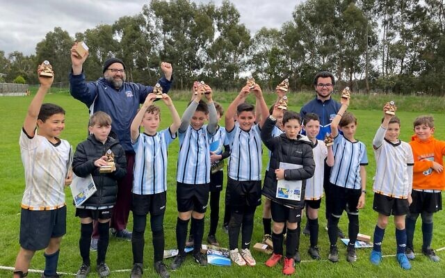 The Maccabi FC Caulfield U10 Hawks boys' team, with their MiniRoos participation trophies last Sunday. The Maccabi FC Caulfield U10 Hawks boys' team, with their MiniRoos participation trophies last Sunday.