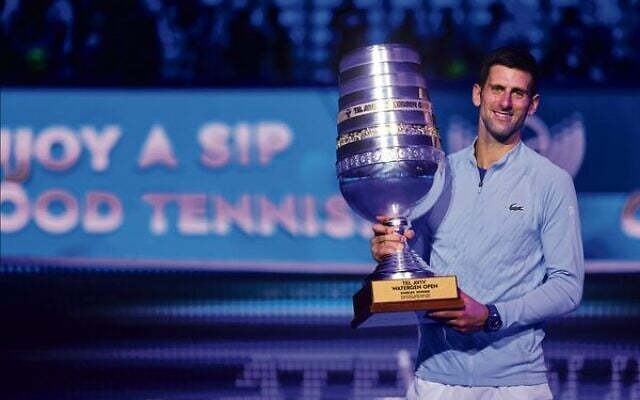Novak Djokovic holding the 2022 Tel Aviv
Watergen Open men's singles trophy on October 2.
Photo: Israel Tennis Association Novak Djokovic holding the 2022 Tel Aviv
Watergen Open men's singles trophy on October 2.
Photo: Israel Tennis Association