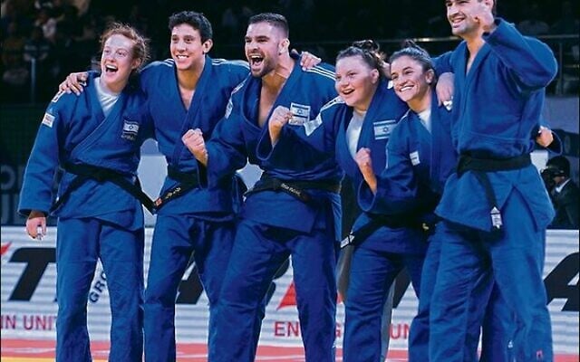 The Israeli mixed Judo team celebrates after winning bronze at the 2022 Judo World Championships in Tashkent last week. Photo: International Judo Federation The Israeli mixed Judo team celebrates after winning bronze at the 2022 Judo World Championships in Tashkent last week. Photo: International Judo Federation