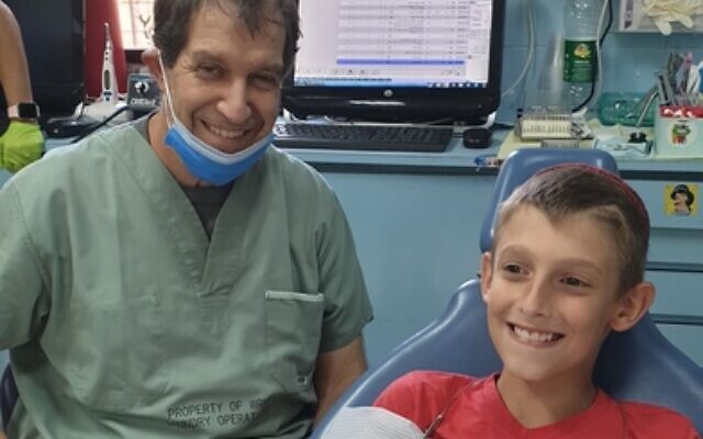 Dr Phil Stein treating Nazri Volensko. Photo: Supplied Dr Phil Stein treating Nazri Volensko. Photo: Supplied