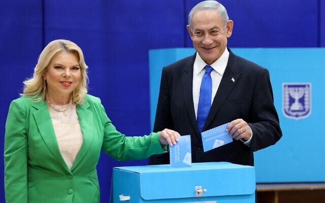 Likud chairman Benjamin Netanyahu (R) and his wife Sara cast their ballot at a polling station in Jerusalem in the country's fifth election in less than four years on November 1, 2022. Photo: Ronaldo Schemidft/AFP via Times of Israel Likud chairman Benjamin Netanyahu (R) and his wife Sara cast their ballot at a polling station in Jerusalem in the country's fifth election in less than four years on November 1, 2022. Photo: Ronaldo Schemidft/AFP via Times of Israel