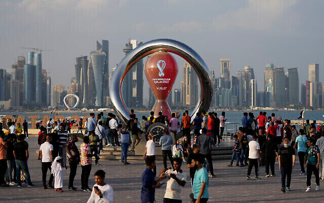 People gather around the official countdown clock showing remaining time until the kick-off of the World Cup 2022, in Doha, Qatar, Friday, Nov. 11, 2022. Israel’s Foreign Ministry has launched a campaign to educate Israeli soccer fans about how to navigate the laws and customs of Qatar ahead of the World Cup there. The conservative Muslim country has no diplomatic relations with Israel but in a landmark first, Israeli soccer fans will be able to travel to the Gulf Arab emirate for the tournament. Photo: AP Photo/Hassan Ammar, File People gather around the official countdown clock showing remaining time until the kick-off of the World Cup 2022, in Doha, Qatar, Friday, Nov. 11, 2022. Israel’s Foreign Ministry has launched a campaign to educate Israeli soccer fans about how to navigate the laws and customs of Qatar ahead of the World Cup there. The conservative Muslim country has no diplomatic relations with Israel but in a landmark first, Israeli soccer fans will be able to travel to the Gulf Arab emirate for the tournament. Photo: AP Photo/Hassan Ammar, File
