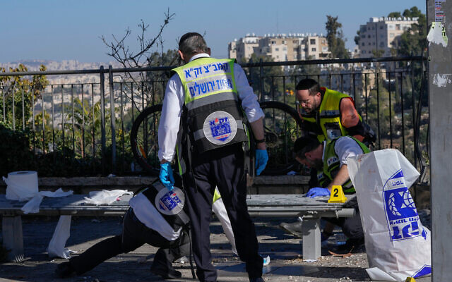 Members of Zaka Rescue and Recovery team clean blood from the scene of an explosion at a bus stop in Jerusalem, Wednesday, Nov. 23, 2022. Photo: AP Photo/Maya Alleruzzo Members of Zaka Rescue and Recovery team clean blood from the scene of an explosion at a bus stop in Jerusalem, Wednesday, Nov. 23, 2022. Photo: AP Photo/Maya Alleruzzo