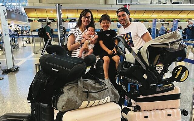 The Israel family returning home from Vancouver with their newborn son. The Israel family returning home from Vancouver with their newborn son.