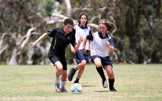 Kovi Leib from team WA (left) and Victorian Ezra Faigenbaum, challenge for the ball at the 2023 Maccabi Junior Carnival in Melbourne on January 16. Photo: Peter Haskin Kovi Leib from team WA (left) and Victorian Ezra Faigenbaum, challenge for the ball at the 2023 Maccabi Junior Carnival in Melbourne on January 16. Photo: Peter Haskin