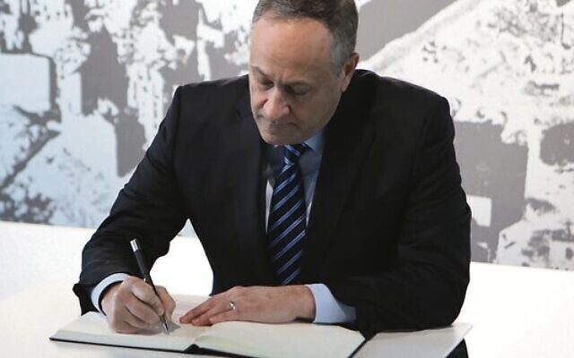 Douglas Emhoff signs a visitor book at the Topography of Terror museum in Berlin. Photo: US Embassy Berlin Douglas Emhoff signs a visitor book at the Topography of Terror museum in Berlin. Photo: US Embassy Berlin