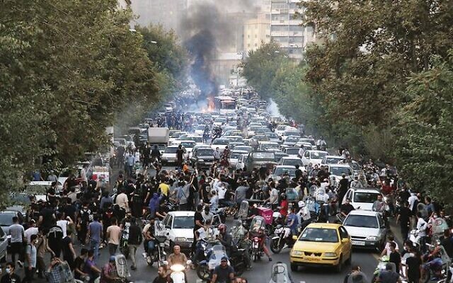 In this photo obtained by the Associated Press outside Iran, demonstrators in downtown Tehran protest the death in custody of Iranian woman Mahsa Amini. Photo: AP In this photo obtained by the Associated Press outside Iran, demonstrators in downtown Tehran protest the death in custody of Iranian woman Mahsa Amini. Photo: AP
