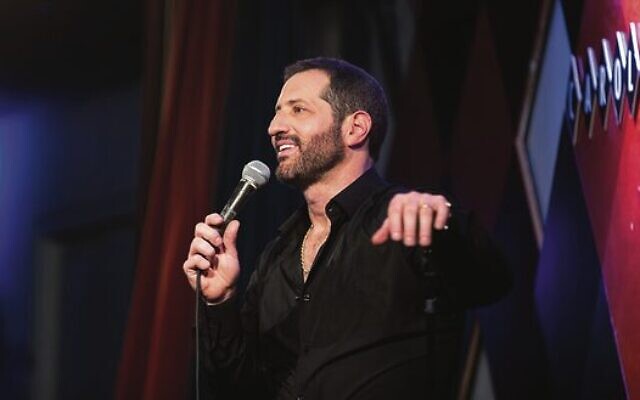 Modi Rosenfeld performing on stage. Modi Rosenfeld performing on stage.