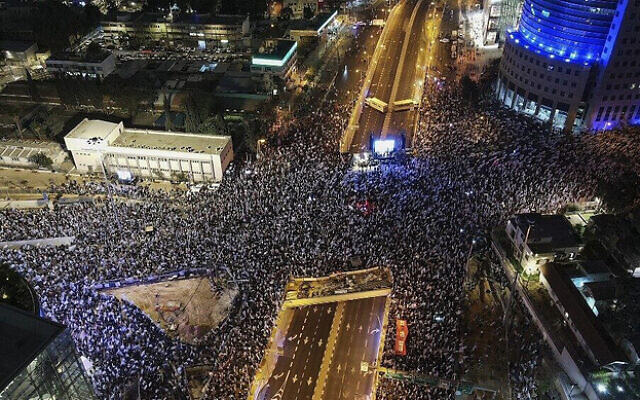 An aerial picture shows a protest against the Israeli government's controversial judicial reform bill in Tel Aviv on March 11, 2023. (Photo by JACK GUEZ / AFP) An aerial picture shows a protest against the Israeli government's controversial judicial reform bill in Tel Aviv on March 11, 2023. (Photo by JACK GUEZ / AFP)