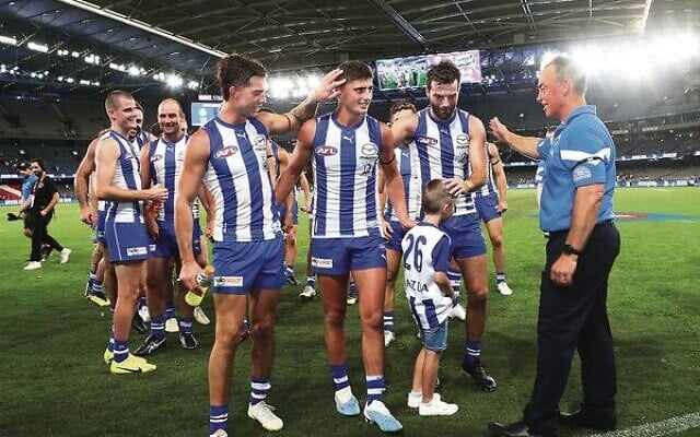 Harry Sheezel (centre) is congratulated by teammates, and Kangaroos coach Alastair Clarkson (right), after North Melbourne's round one win over the Eagles at Marvel Stadium last Saturday. Photos: Peter Haskin Harry Sheezel (centre) is congratulated by teammates, and Kangaroos coach Alastair Clarkson (right), after North Melbourne's round one win over the Eagles at Marvel Stadium last Saturday. Photos: Peter Haskin