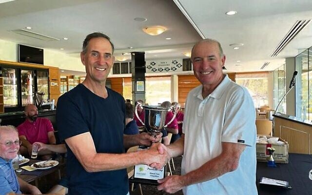 WA captain Ian Schwartz (left) presented with the Presidents Cup trophy by Maccabi Golf Australia president and team Victoria member Allen Garb. WA captain Ian Schwartz (left) presented with the Presidents Cup trophy by Maccabi Golf Australia president and team Victoria member Allen Garb.