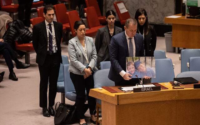 Israel's Ambassador to the United Nations Gilad Erdan (2R) and other Israeli delegates hold a moment of silence for terror victims brothers Yaakov and Asher Palley during the United Nations Security Council meeting on the situation in the Middle East, at the United Nations headquarters in New York City on February 20, 2023. Photo: Yuki IWAMURA/AFP Israel's Ambassador to the United Nations Gilad Erdan (2R) and other Israeli delegates hold a moment of silence for terror victims brothers Yaakov and Asher Palley during the United Nations Security Council meeting on the situation in the Middle East, at the United Nations headquarters in New York City on February 20, 2023. Photo: Yuki IWAMURA/AFP