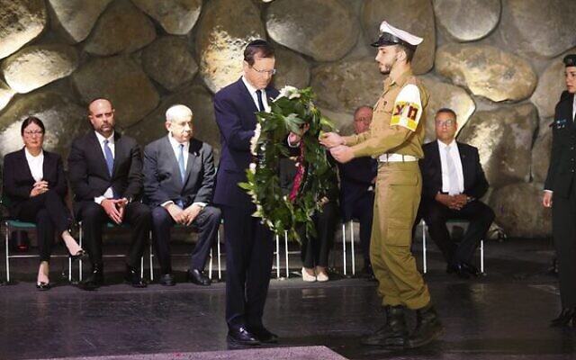 Israeli President Isaac Herzog prepares to lay a wreath at Yad Vashem. Photo: Yad Vashem Israeli President Isaac Herzog prepares to lay a wreath at Yad Vashem. Photo: Yad Vashem