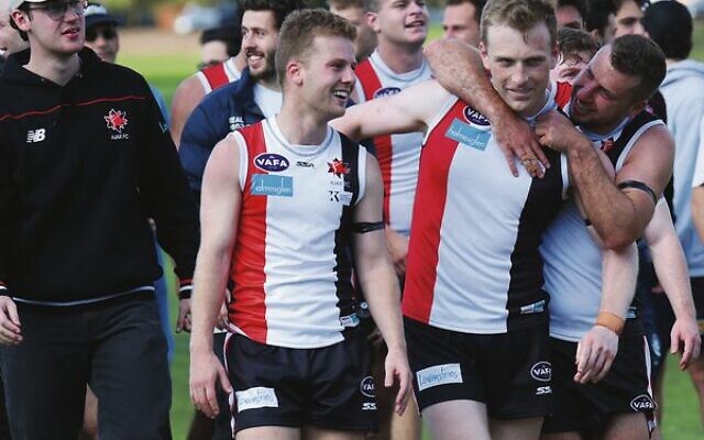 Jackas senior reserves player Jordan Bade-Kennett, centre, is embraced by teammates after last Sunday's win. Photo: Peter Haskin Jackas senior reserves player Jordan Bade-Kennett, centre, is embraced by teammates after last Sunday's win. Photo: Peter Haskin