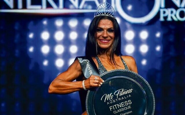 Martine Lewis in 2019 with her Ms Fitness Australia Pro Champion trophy. Photo: Nelson Azevedo Martine Lewis in 2019 with her Ms Fitness Australia Pro Champion trophy. Photo: Nelson Azevedo