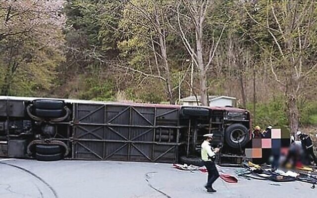 The overturned bus. Photo: Chungbuk Fire Service The overturned bus. Photo: Chungbuk Fire Service