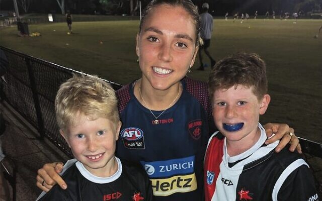 U9 players Eli (left) and Raphy Silverman (right) with AFLW star Eliza McNamara during training on April 20. U9 players Eli (left) and Raphy Silverman (right) with AFLW star Eliza McNamara during training on April 20.