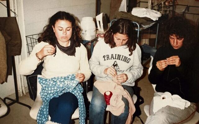 Deborah (left), mending clothes in the kibbutz laundry. Deborah (left), mending clothes in the kibbutz laundry.