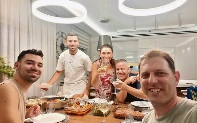 Shane (front, right) enjoying a family Shabbat dinner in Netanya. Shane (front, right) enjoying a family Shabbat dinner in Netanya.