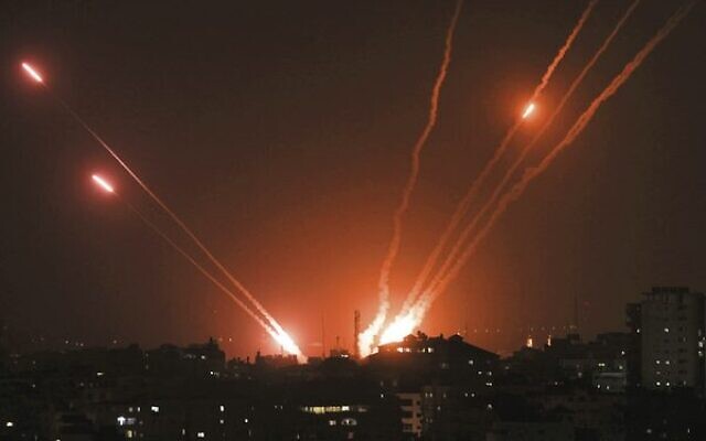 Rockets are fired from Gaza City towards Israel on May 13. Photo: Mahmud Hams / AFP Rockets are fired from Gaza City towards Israel on May 13. Photo: Mahmud Hams / AFP