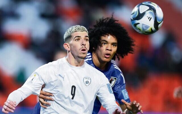 Israel's Dor Turgeman (left) eyes the ball in his team's 2-1 win against Japan in the 2023 FIFA U20 Men's World Cup. Photo: AP Photo/Natacha Pisarenko Israel's Dor Turgeman (left) eyes the ball in his team's 2-1 win against Japan in the 2023 FIFA U20 Men's World Cup. Photo: AP Photo/Natacha Pisarenko