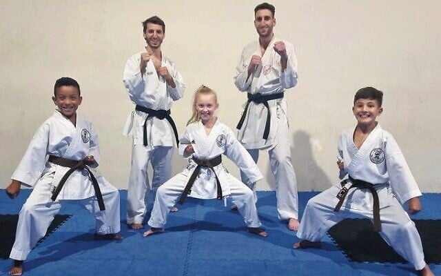 Richard Basckin (back left) and his Australian teammate Yonatan Freund, with young participants in the opening week of the duo's Miyaki Kan Karate East dojo. Richard Basckin (back left) and his Australian teammate Yonatan Freund, with young participants in the opening week of the duo's Miyaki Kan Karate East dojo.