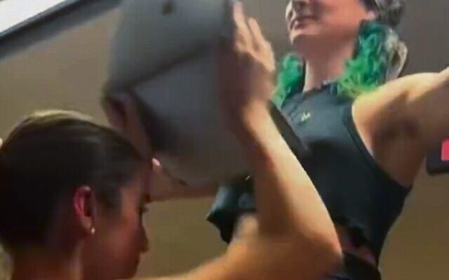 A screenshot from student Freya Leach's video shows her (left) being obstructed by another student. A screenshot from student Freya Leach's video shows her (left) being obstructed by another student.