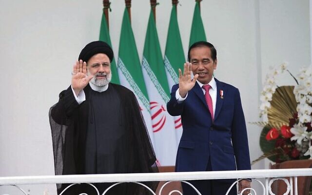 Iran's President Ebrahim Raisi, left, and Indonesian President Joko Widodo, right, wave to journalists during their meeting at the Presidential Palace in Bogor, Indonesia. Photo: Achmad Ibrahim/AP Iran's President Ebrahim Raisi, left, and Indonesian President Joko Widodo, right, wave to journalists during their meeting at the Presidential Palace in Bogor, Indonesia. Photo: Achmad Ibrahim/AP