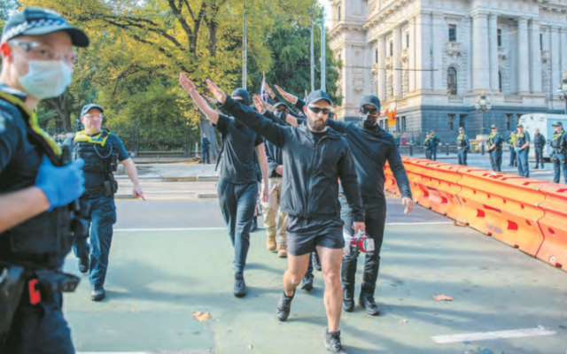 Neo-Nazis perform salutes at a demonstration in Melbourne on May 13, 2023. Photo: Michael Currie/SOPA Images/Sipa USA Neo-Nazis perform salutes at a demonstration in Melbourne on May 13, 2023. Photo: Michael Currie/SOPA Images/Sipa USA