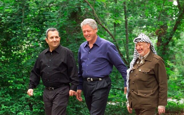 US President Bill Clinton (centre), Israeli Prime Minister Ehud Barak (left) and Palestinian leader Yasser Arafat at Camp David at the start of the Middle East summit on July 11, 2000. Photo: AP Photo/Ron Edmonds, File US President Bill Clinton (centre), Israeli Prime Minister Ehud Barak (left) and Palestinian leader Yasser Arafat at Camp David at the start of the Middle East summit on July 11, 2000. Photo: AP Photo/Ron Edmonds, File