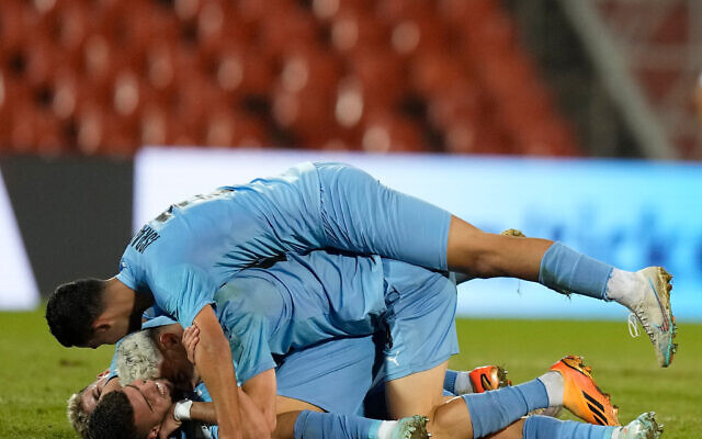 Israel’s players celebrate after defeating Uzbekistan 1-0 and making it to the next round of the FIFA U-20 World Cup at the Malvinas Argentinas stadium in Mendoza, Argentina, Tuesday, May 30, 2023. (AP/Natacha Pisarenko) Israel’s players celebrate after defeating Uzbekistan 1-0 and making it to the next round of the FIFA U-20 World Cup at the Malvinas Argentinas stadium in Mendoza, Argentina, Tuesday, May 30, 2023. (AP/Natacha Pisarenko)