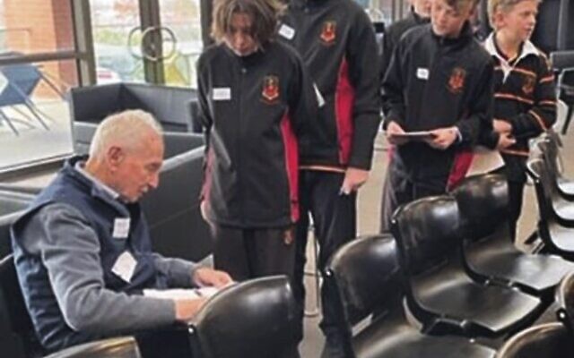 Professor Henry Ekert receives a thank you card from students at St Joseph's College, Geelong. Professor Henry Ekert receives a thank you card from students at St Joseph's College, Geelong.