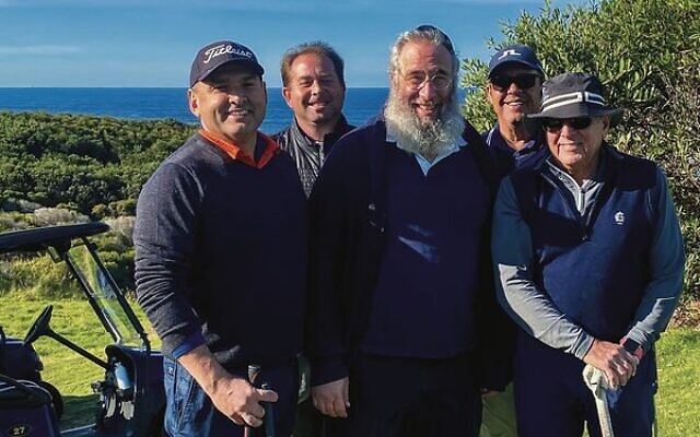Rabbi Mendel Kastel (centre) with winning team members from Comlink, (from left) Paul Ghanem, John Ellis, Brad Armstrong, and Gary Cohen. Rabbi Mendel Kastel (centre) with winning team members from Comlink, (from left) Paul Ghanem, John Ellis, Brad Armstrong, and Gary Cohen.