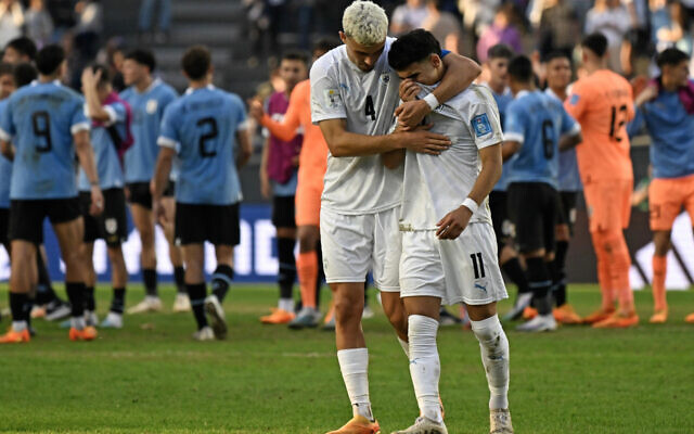 Israel's defender Stav Lemkin, left, comforts forward Hamza Shibli after losing to Uruguay the Argentina 2023 U-20 World Cup semi-final match between Uruguay and Israel at the Estadio Unico Diego Armando Maradona stadium in La Plata, Argentina. Photo: Luis ROBAYO/AFP Israel's defender Stav Lemkin, left, comforts forward Hamza Shibli after losing to Uruguay the Argentina 2023 U-20 World Cup semi-final match between Uruguay and Israel at the Estadio Unico Diego Armando Maradona stadium in La Plata, Argentina. Photo: Luis ROBAYO/AFP
