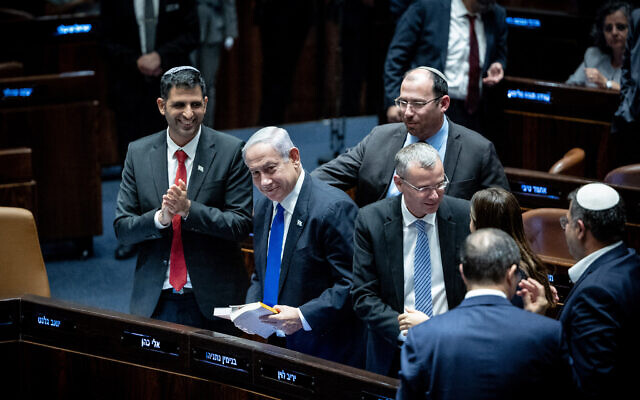 Prime Minister Benjamin Netanyahu, Juztice Minister Yariv Levin and other coalition lawmakers celebrate after the Knesset approves the first reading of the "reasonableness" bill, early on July 11, 2023. Photo: Yonatan Sindel/Flash90 Prime Minister Benjamin Netanyahu, Juztice Minister Yariv Levin and other coalition lawmakers celebrate after the Knesset approves the first reading of the "reasonableness" bill, early on July 11, 2023. Photo: Yonatan Sindel/Flash90