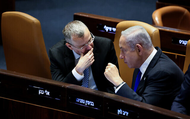 Prime Minister Benjamin Netanyahu speaks with Justice Minister Yariv Levin as the Knesset deliberates a bill to cancel the judiciary’s review powers over the ‘reasonableness’ of government decisions, in Jerusalem on July 10, 2023. Photo: Yonatan Sindel/Flash90 Prime Minister Benjamin Netanyahu speaks with Justice Minister Yariv Levin as the Knesset deliberates a bill to cancel the judiciary’s review powers over the ‘reasonableness’ of government decisions, in Jerusalem on July 10, 2023. Photo: Yonatan Sindel/Flash90