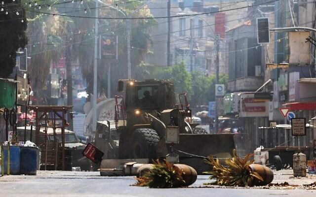 An Israeli army bulldozer drives through Jenin in the West Bank.
Photo: Jaafar Ashtiyeh/AFP An Israeli army bulldozer drives through Jenin in the West Bank.
Photo: Jaafar Ashtiyeh/AFP