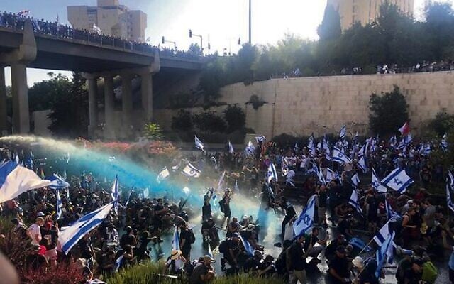 Police fire water cannons at anti-overhaul protesters on Jerusalem's Begin Highway.
Photo: Times of Israel Police fire water cannons at anti-overhaul protesters on Jerusalem's Begin Highway.
Photo: Times of Israel