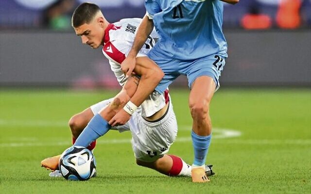 Israel's Stav Lemkin wins a challenge for the ball versus Georgia in the U21 men's European Championships. Photo: Israel Football Association Israel's Stav Lemkin wins a challenge for the ball versus Georgia in the U21 men's European Championships. Photo: Israel Football Association