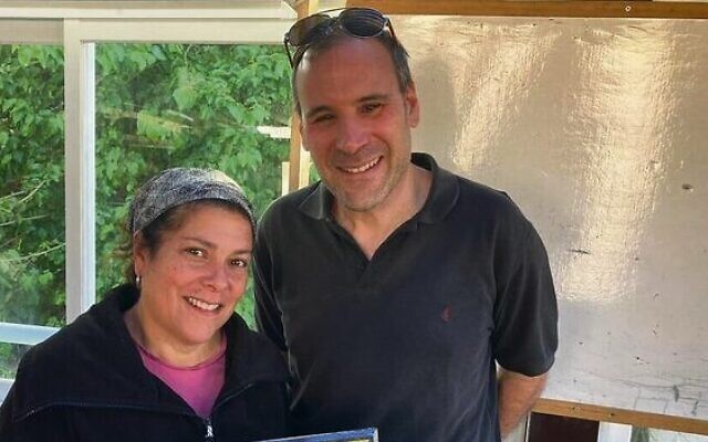 Gabi and Rabbi Shalom Hammer with a memorial to daughter Gila. Gabi and Rabbi Shalom Hammer with a memorial to daughter Gila.