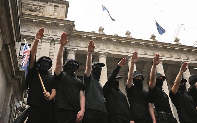 Neo-Nazis outside Parliament in Melbourne on Saturday, March 18.
Photo: AAP Image/James Ross Neo-Nazis outside Parliament in Melbourne on Saturday, March 18.
Photo: AAP Image/James Ross
