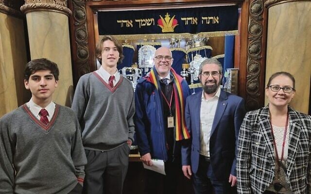 Students and staff with Rabbi Glasman in front of the Torah Scrolls.
Photo: Paul Topol. Students and staff with Rabbi Glasman in front of the Torah Scrolls.
Photo: Paul Topol.