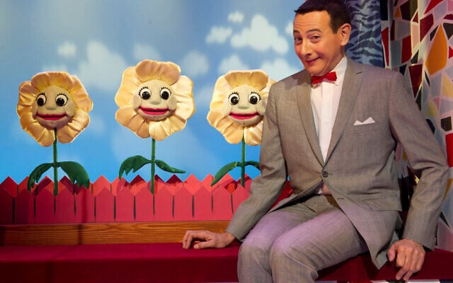 Paul Reubens, in character as Pee-wee Herman, poses on stage after a performance of The Pee-wee Herman Show in 2010. Photo: AP Photo/Charles Sykes Paul Reubens, in character as Pee-wee Herman, poses on stage after a performance of The Pee-wee Herman Show in 2010. Photo: AP Photo/Charles Sykes