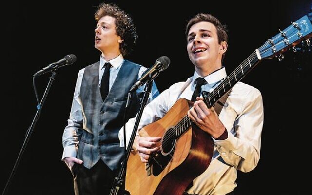 William Sharp and Oliver Cave as Simon and Garfunkel. William Sharp and Oliver Cave as Simon and Garfunkel.