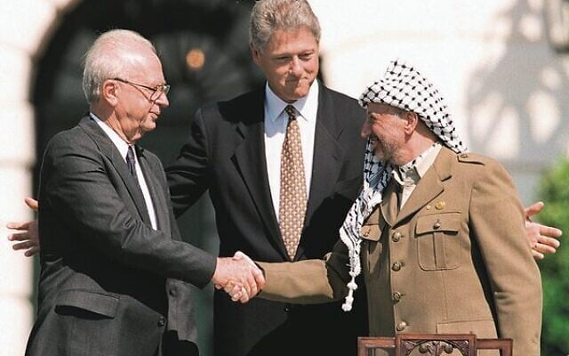 Yitzhak Rabin (left) and Yasser Arafat (right) shake hands at the White House on September 13, 1993, as US president Bill Clinton looks on. Photo: J. David Ake/AFP/Getty Images Yitzhak Rabin (left) and Yasser Arafat (right) shake hands at the White House on September 13, 1993, as US president Bill Clinton looks on. Photo: J. David Ake/AFP/Getty Images