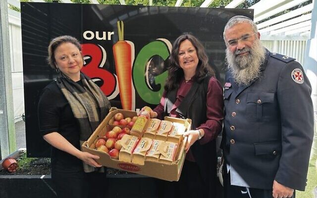 From left: Christine Elder, Laya and Rabbi Dovid Slavin.
Photo: Noel Kessel From left: Christine Elder, Laya and Rabbi Dovid Slavin.
Photo: Noel Kessel