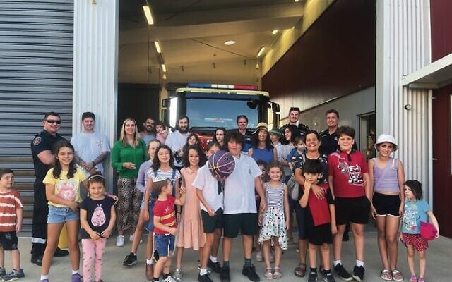 Children from Chabad of North Queensland delivered honey cakes to the Smithfield Fire Department. Children from Chabad of North Queensland delivered honey cakes to the Smithfield Fire Department.