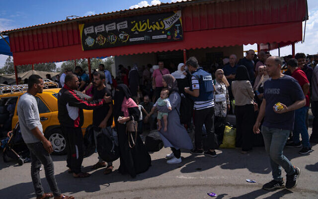 Palestinians at the Rafah border crossing between Gaza and Egypt on October 16, 2023. Photo: Fatima Shbair/AP Palestinians at the Rafah border crossing between Gaza and Egypt on October 16, 2023. Photo: Fatima Shbair/AP