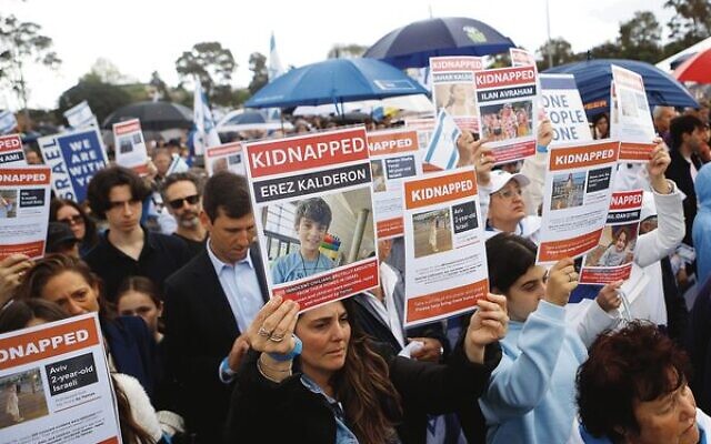People held up photos of some of the hostages being held by Hamas in Gaza People held up photos of some of the hostages being held by Hamas in Gaza